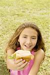 High angle view of a girl holding a burger