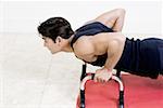 High angle view of a mid adult man doing push-ups