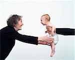 Woman Reaching for Grandchild