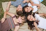 Portrait of Children Lying on Blanket