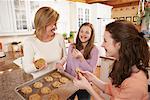 Girls Eating Cookies with Mother