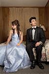 Young Couple in Formal Wear in Motel Room