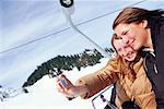 Women on Ski Lift Taking Self Portrait