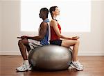 People Meditating on Exercise Ball