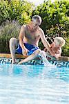 Father and Son by Swimming Pool