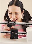 Woman Weighing Herself