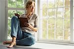 Woman Sitting by Window