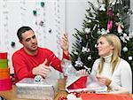 Couple wrapping christmas presents