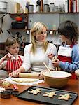 Mother and children making cookies