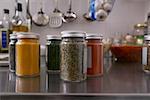 Jars filled with herbs and spices in kitchen