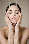 Woman under shower of water