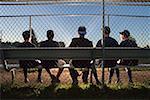 Five teenagers watching from the sidelines