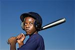 Teenage boy about to swing baseball bat