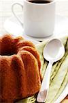 Close-up of a cake and a cup of coffee