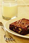 Close-up of a brownie and a glass of milk