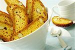 Close-up of slices of almond cake in a bowl