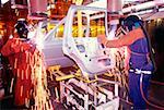 Welder working on car doors in an assembly line, Newark, Delaware, USA