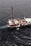 Aerial view of an oil drilling ship in the sea