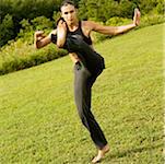 Young woman practicing martial arts