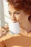 Close-up of a senior woman drinking coffee