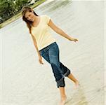 Teenage girl walking on the beach