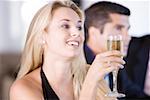 Close-up of a young woman holding a glass of champagne