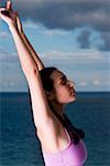 Side profile of a young woman meditating