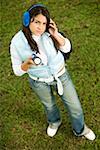 High angle view of a teenage girl holding a flashlight