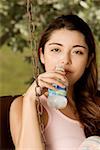 Portrait of a young woman holding a water bottle