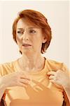 Close-up of a senior woman gesturing with her hands