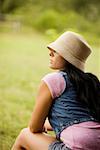 Rear view of a young woman in the garden