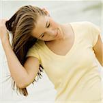 Close-up of a teenage girl with her hand in her hair