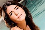 Close-up of a young woman at the poolside