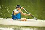 Portrait of a mid adult man boating in a river