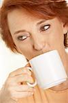 Close-up of a senior woman drinking a cup of coffee
