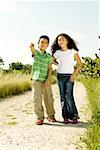 Boy and a girl standing in a walkway