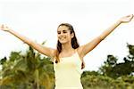 Girl standing with her arms outstretched