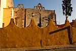 Arched wall in front of an old ruin, Mexico