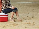 Woman Sitting on Cooler