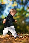 Child Walking through Leaves