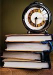 Alarm Clock on Top of Textbooks