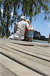 Couple Sitting on Dock