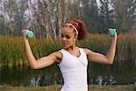Woman Lifting Weights Outdoors