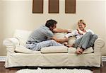 Couple Arguing on Sofa