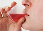 Woman Drinking Cough Syrup