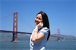 Woman Using Cell Phone Outdoors, San Fransisco, California, USA