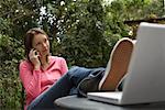 Woman Sitting Outside Talking On Cell Phone