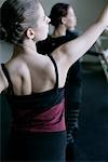 Female ballet dancers doing exercises