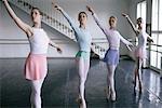 Female ballet dancers doing the toe-dance side-by-side