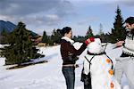 Young couple making a snowman